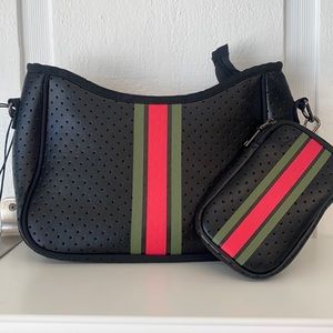 Black crossbody with red/green strips